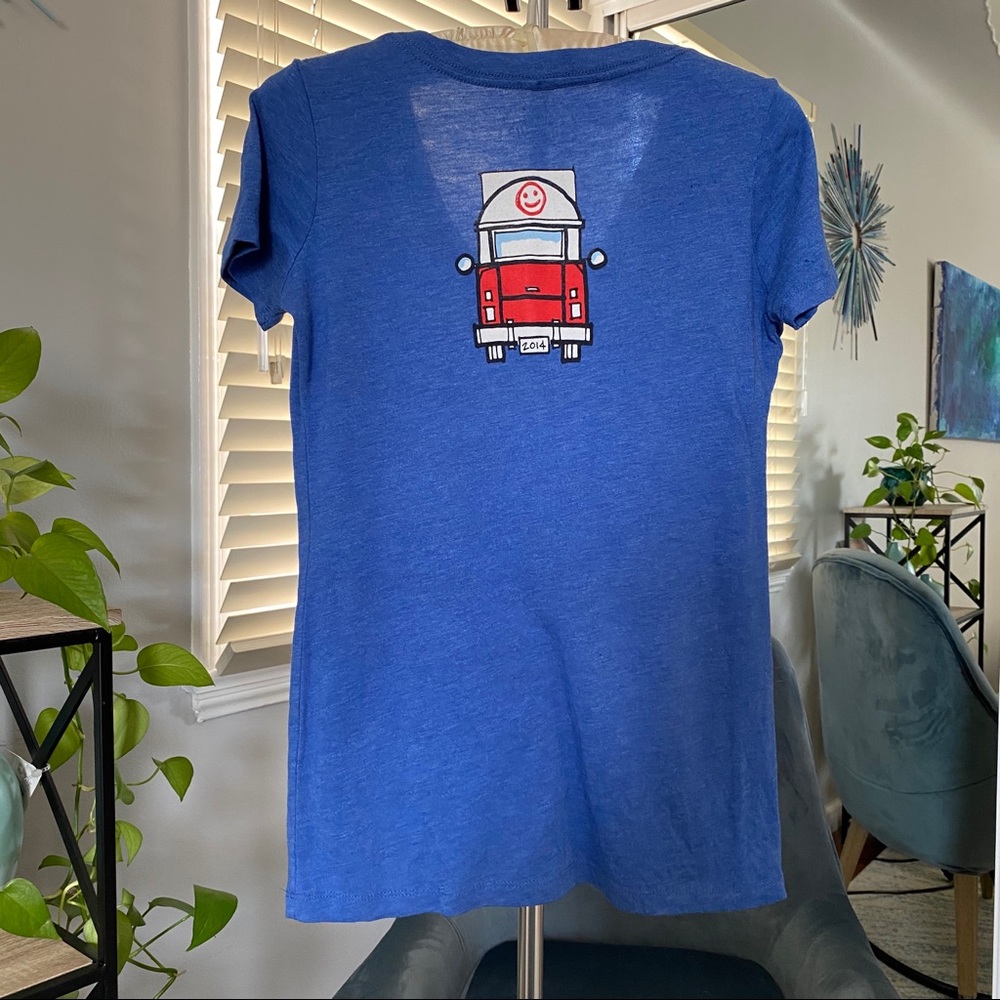 Simmzy’s blue v-neck tee. - Picture 2 of 3